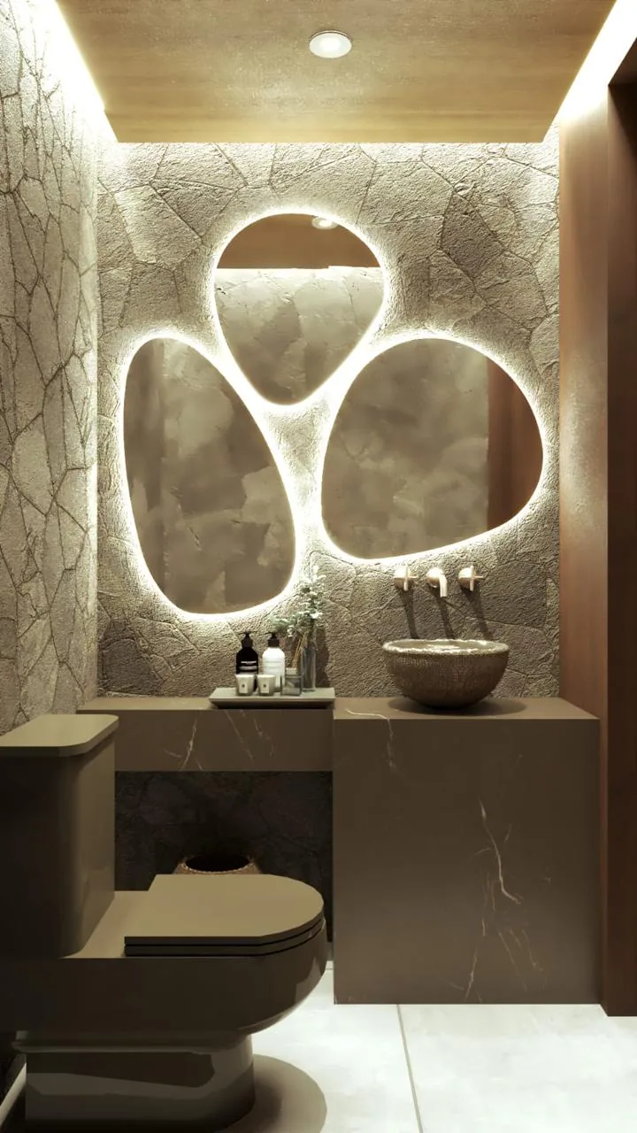 Lavabo com espelhos redondos iluminados e parede texturizada